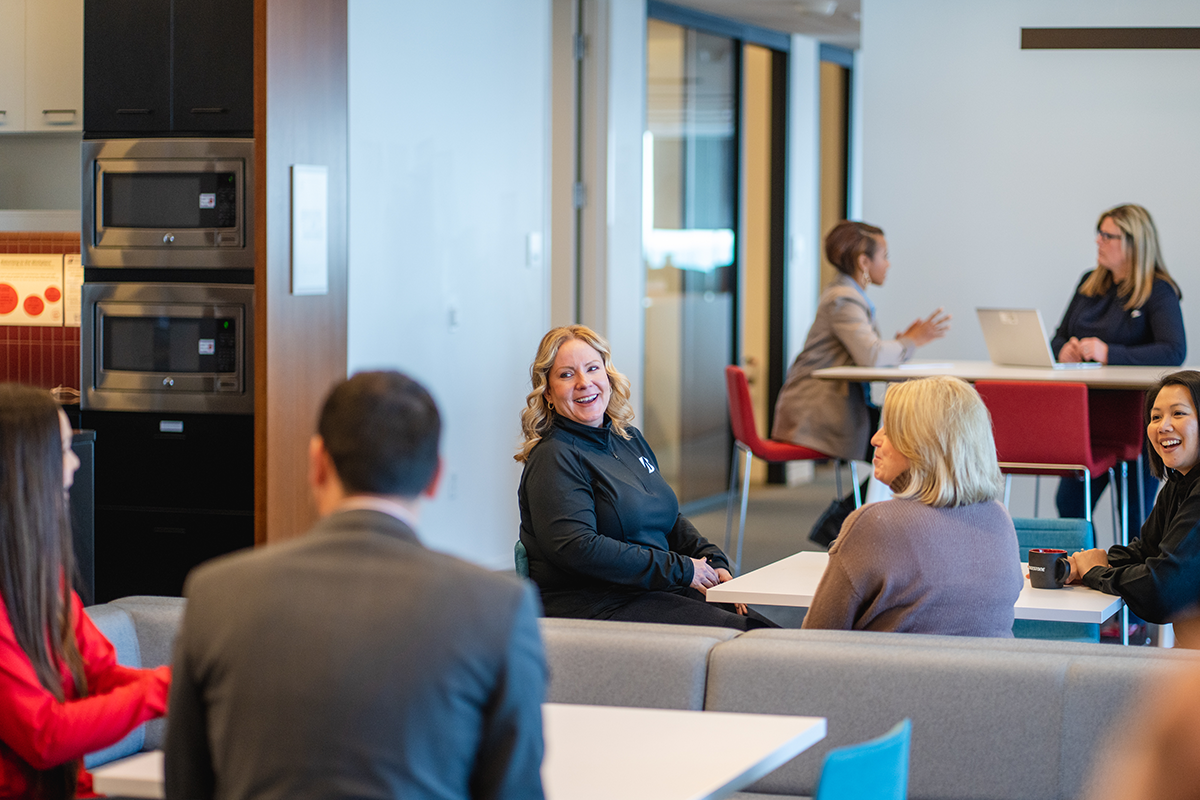 a group of people sitting at tables