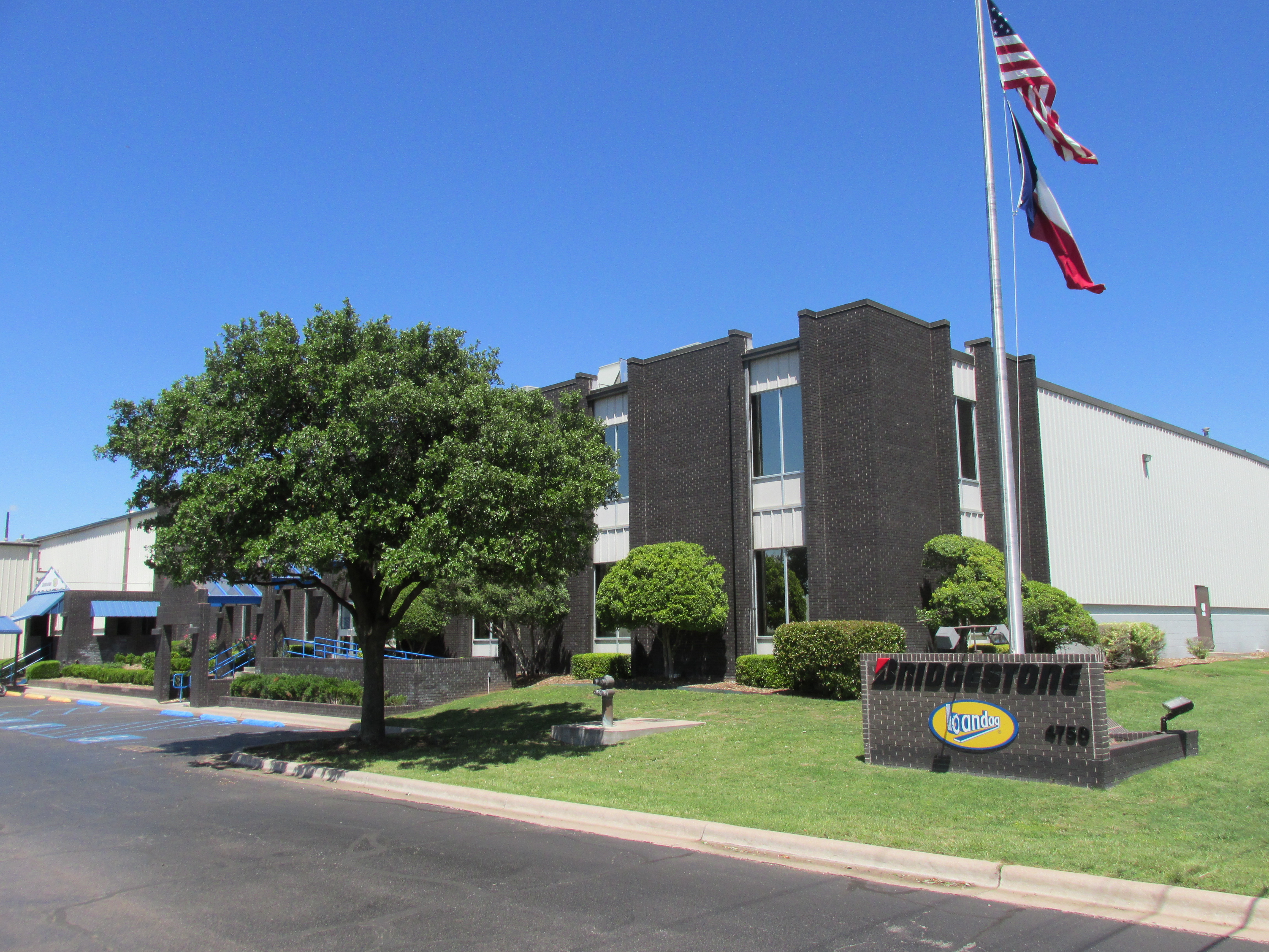 a building with flags on the pole