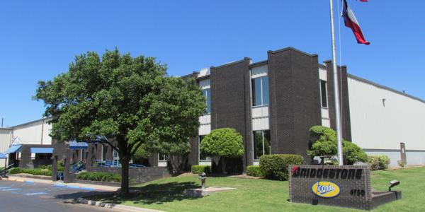 a building with flags on the pole