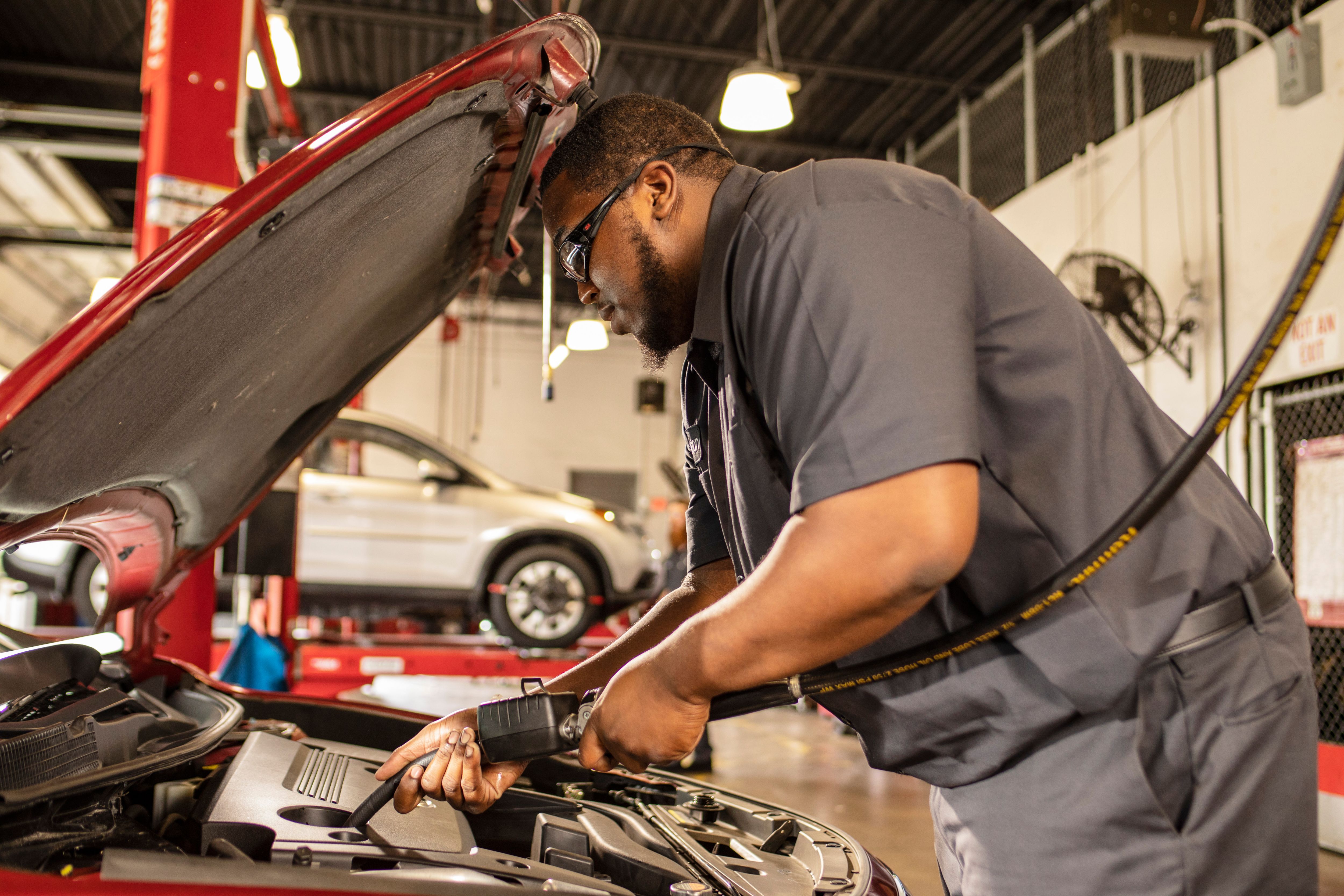 a man working on a car engine