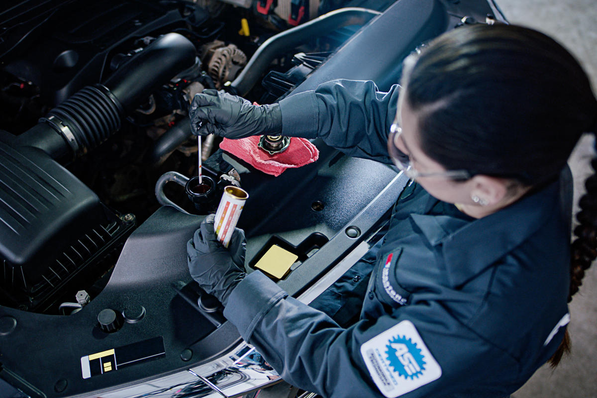 a woman working on a car