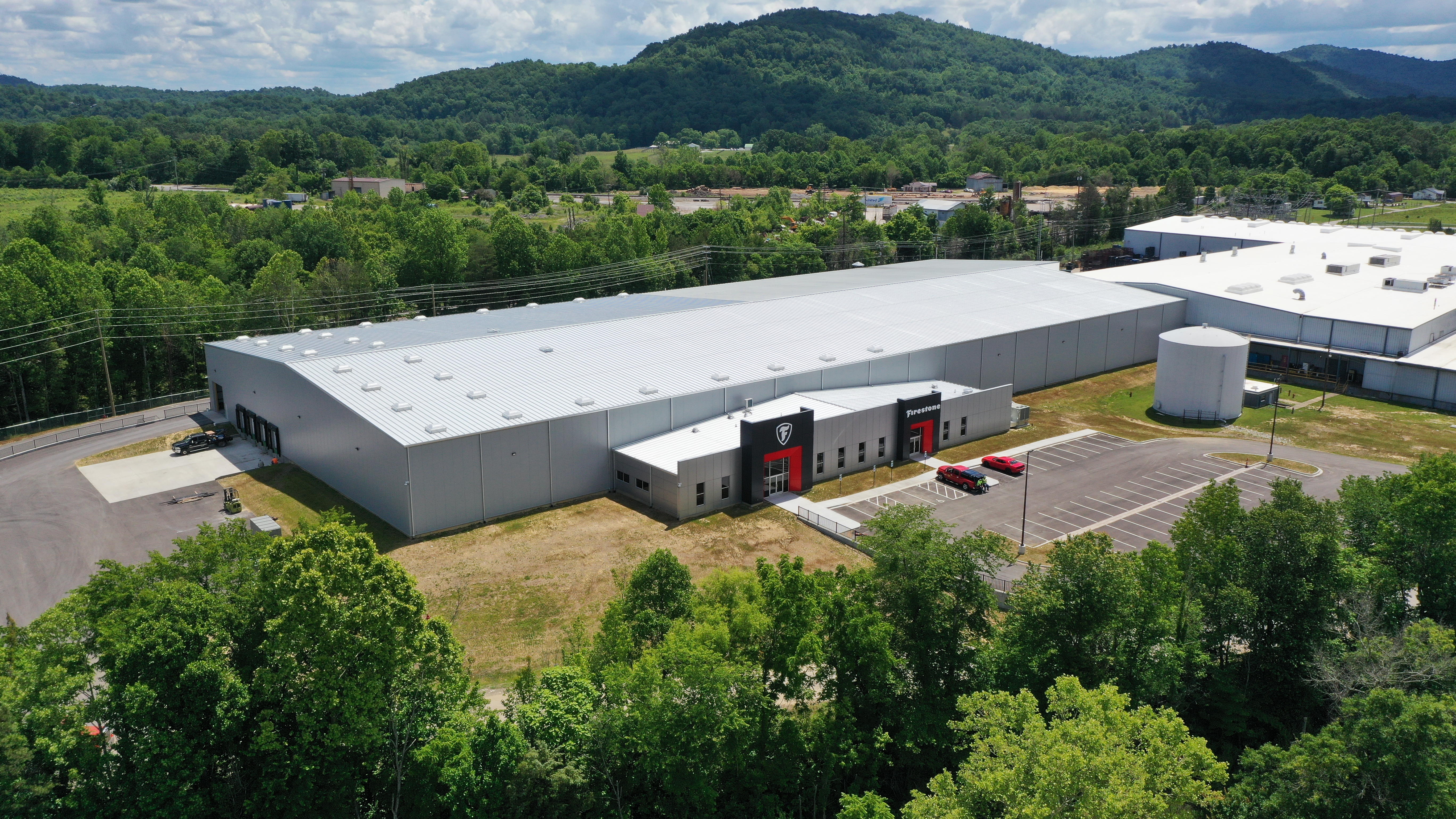 a large building with cars parked in front of it